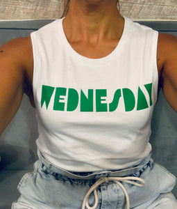 White muscle tee with retro graphic "Wednesday" printed on it, worn by a model.